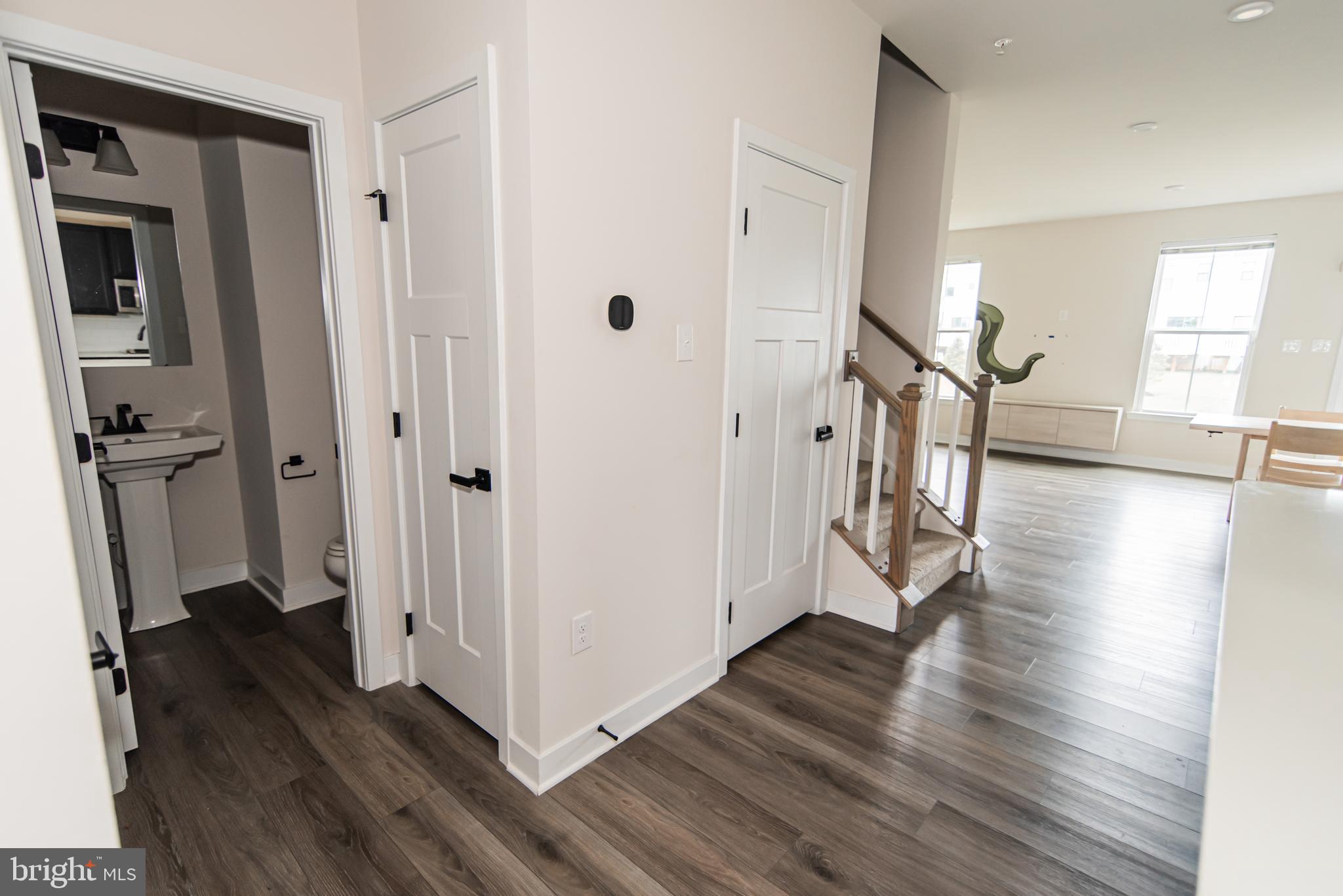 7953 Milltown Circle Cheltenham, PA 19012 - Photo 15 of 24 a view of a hallway with wooden floor and stairs