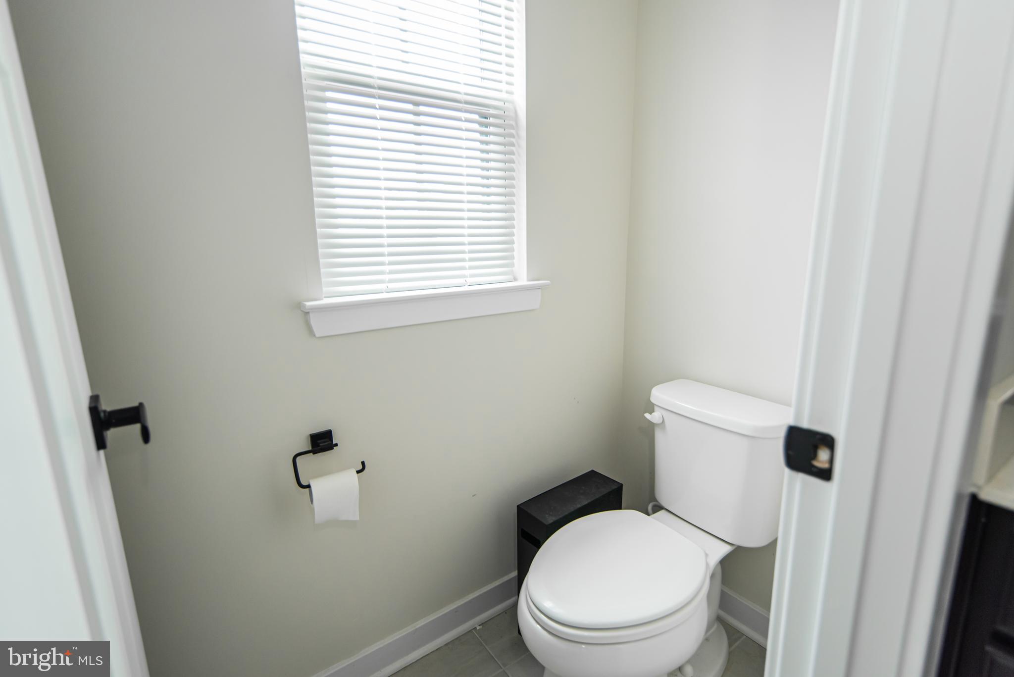 7953 Milltown Circle Cheltenham, PA 19012 - Photo 19 of 24 a white toilet sitting next to a bathroom sink