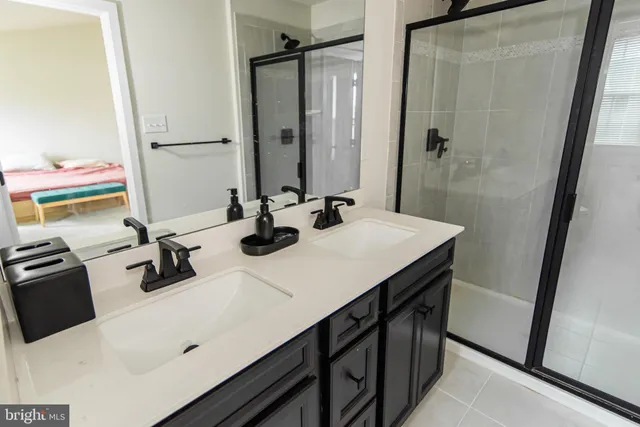 a bathroom with a sink vanity and a mirror