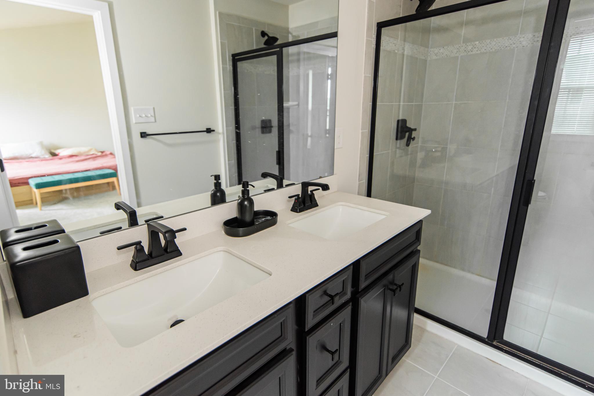 7953 Milltown Circle Cheltenham, PA 19012 - Photo 20 of 24 a bathroom with a sink vanity and a mirror