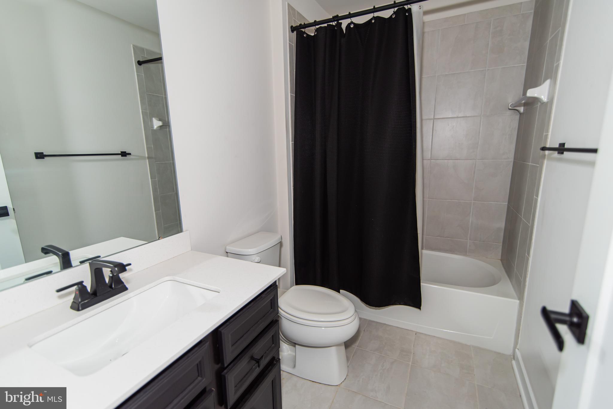 7953 Milltown Circle Cheltenham, PA 19012 - Photo 24 of 24 a bathroom with a sink toilet and shower