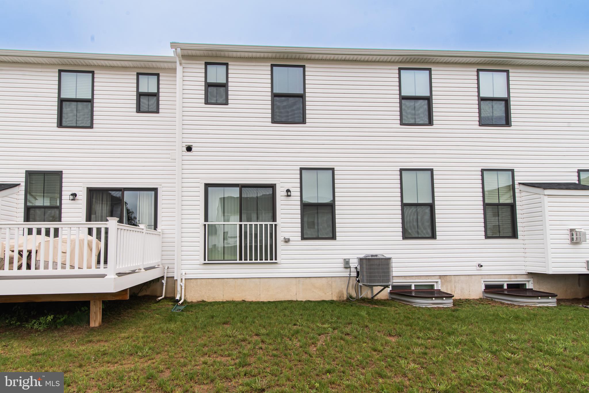 7953 Milltown Circle Cheltenham, PA 19012 - Photo 3 of 24 a front view of a house with yard