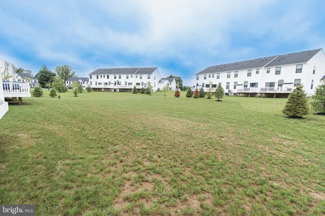 a front view of building with garden