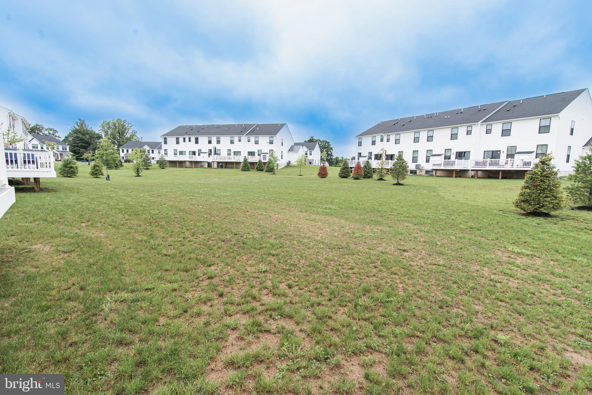 7953 Milltown Circle Cheltenham, PA 19012 - Photo 4 of 24 a front view of building with garden