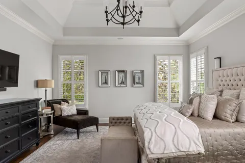 a bedroom with a bed and a couch