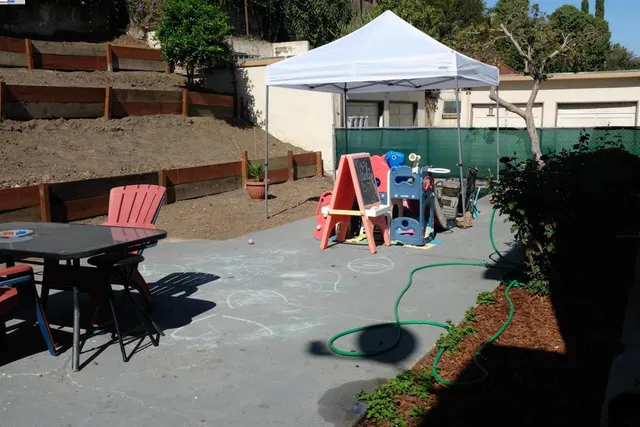 an aerial view of a house roof deck and patio