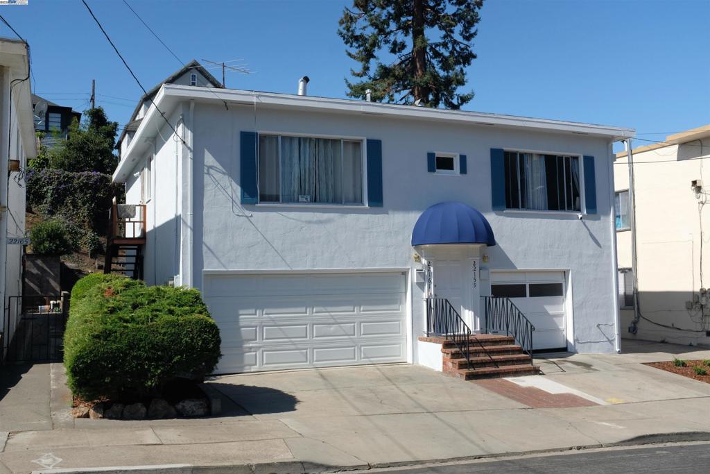 22157 Main Street Hayward, CA 94541 - Photo 9 of 10 a front view of a house with garden