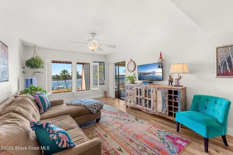 a living room filled with furniture and a window