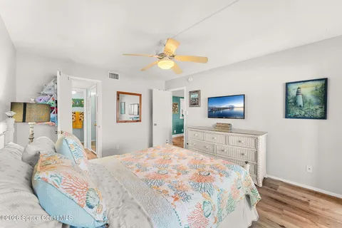 a bathroom with a sink mirror and vanity