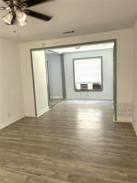 6415 Latta Street, Unit 1 Dallas, TX 75227 - Photo 2 of 5 a view of room with window and wooden floor