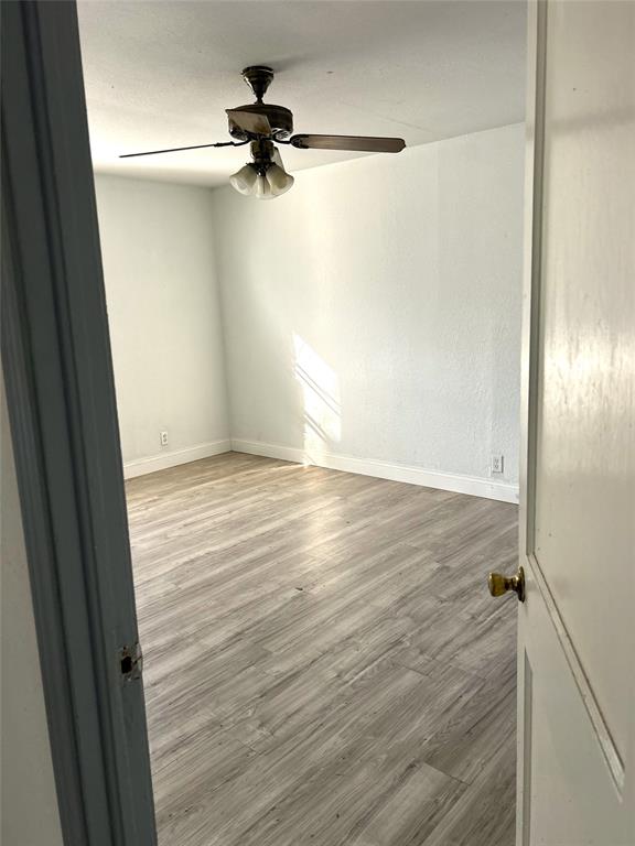 6415 Latta Street, Unit 1 Dallas, TX 75227 - Photo 4 of 5 a view of a room with wooden floor