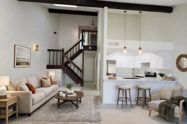 a living room with furniture and a table