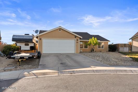 552 Spur Court Fernley, NV 89408 - Photo 1 of 46 a front view of a house with a yard