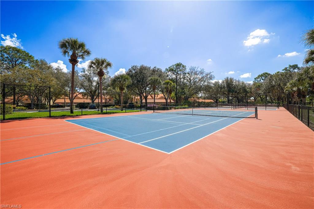 305 Robin Hood Circle, Unit 101 Naples, FL 34104 - Photo 26 of 31 a view of a tennis court