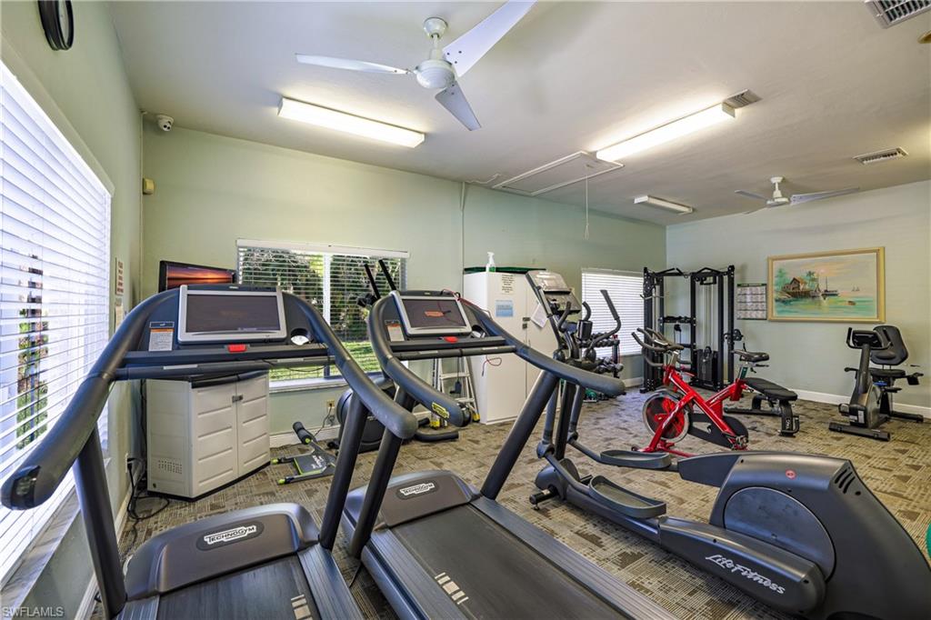 305 Robin Hood Circle, Unit 101 Naples, FL 34104 - Photo 30 of 31 a view of a room with gym equipment