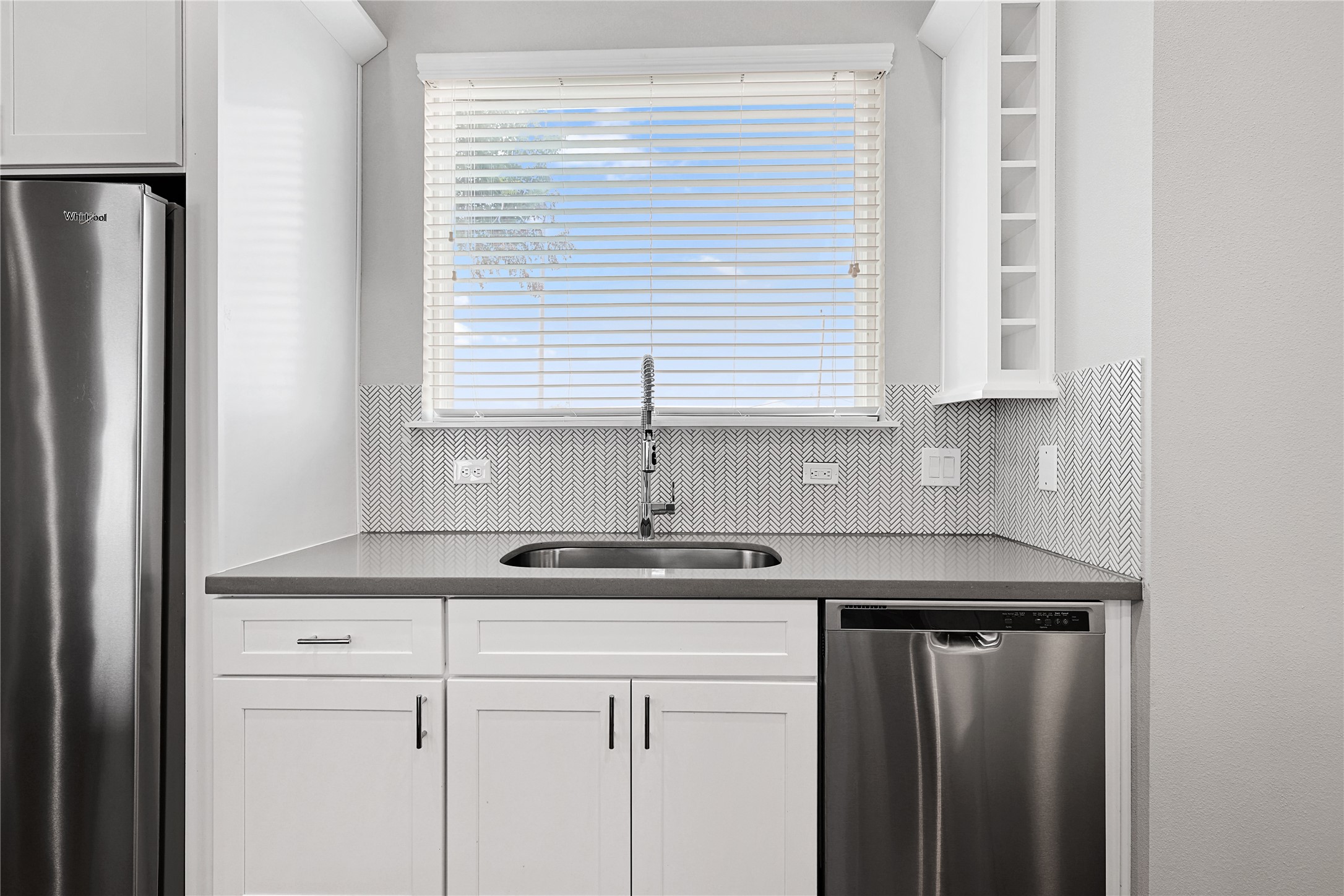 1222 Upton Street Houston, TX 77020 - Photo 16 of 41 a kitchen with stainless steel appliances granite countertop a sink and a window