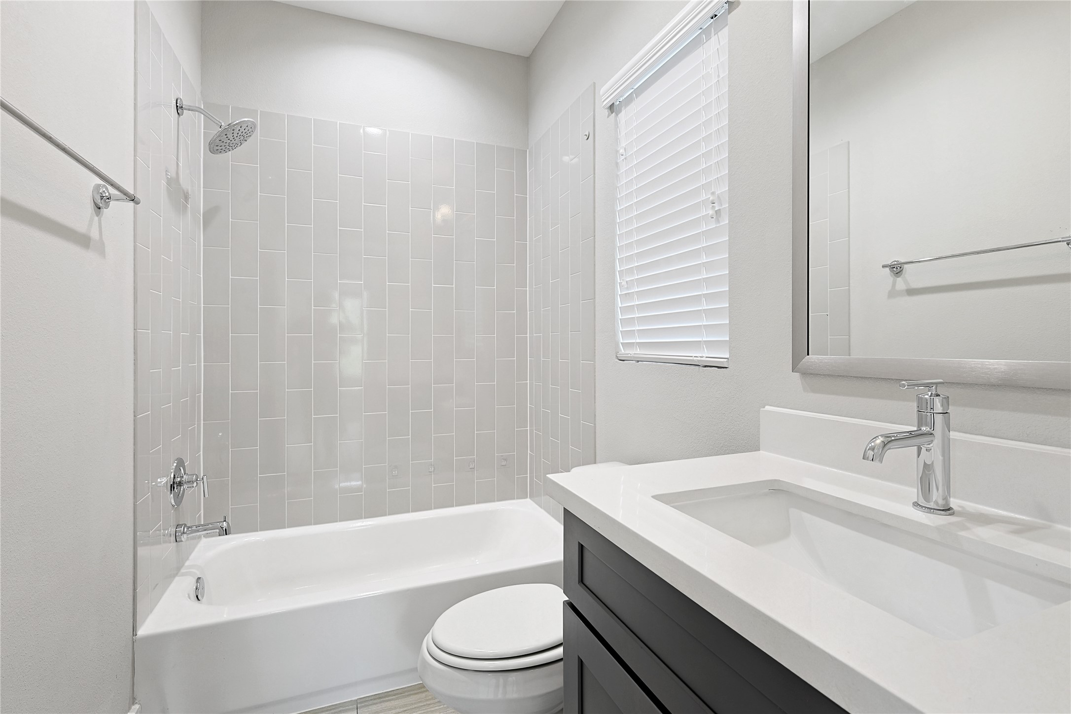 1222 Upton Street Houston, TX 77020 - Photo 29 of 41 a bathroom with a granite countertop sink toilet and shower