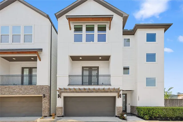 a bathroom with a granite countertop sink and a potted plant