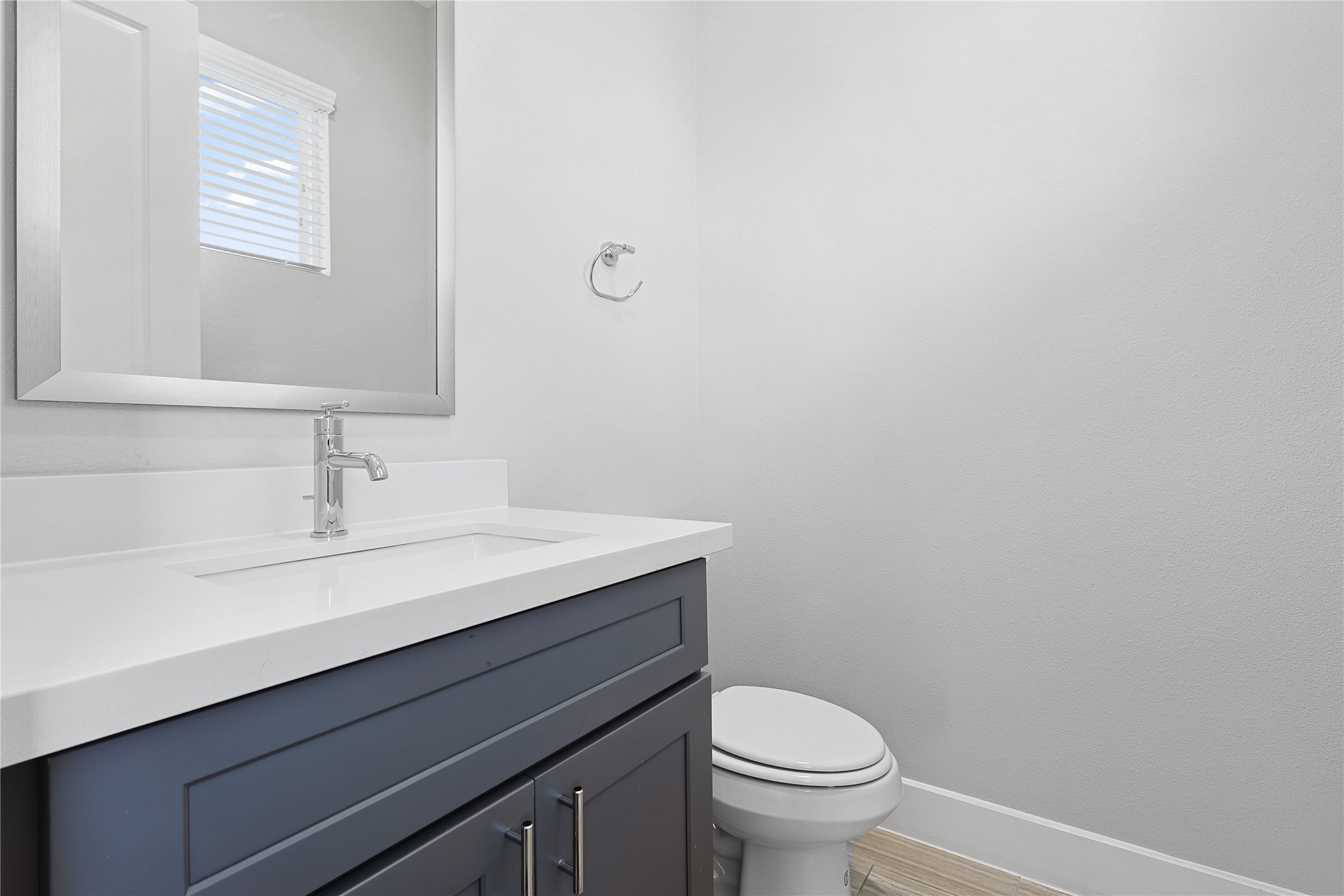 1222 Upton Street Houston, TX 77020 - Photo 31 of 41 a bathroom with a sink a toilet and a mirror