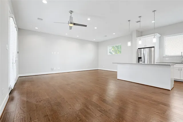 a view of kitchen with furniture and wooden floor