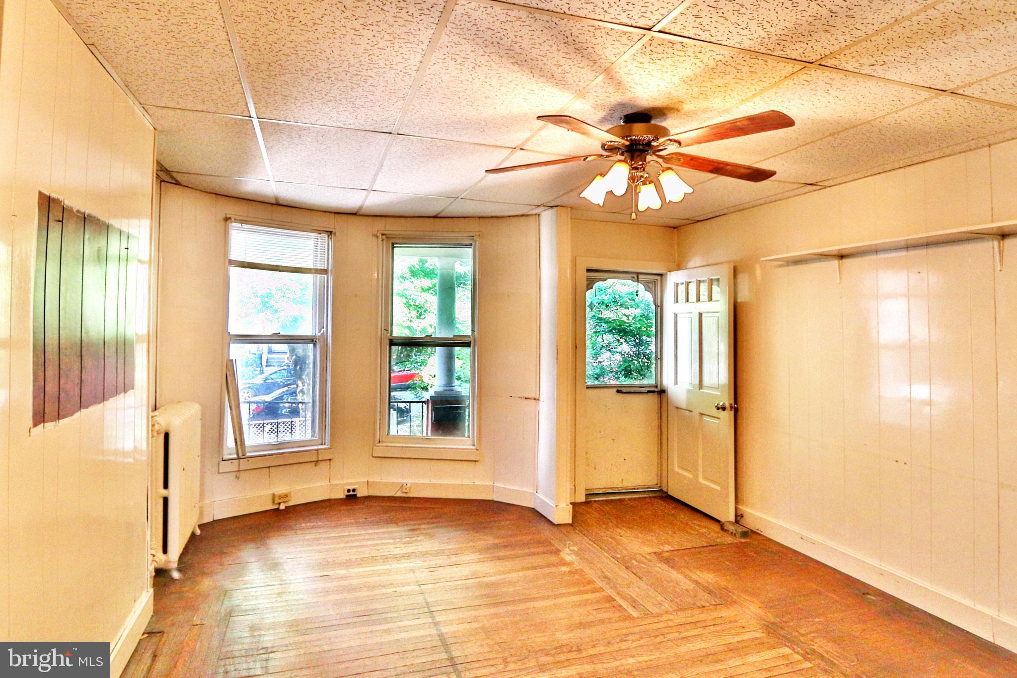 3529 Roland Avenue Baltimore, MD 21211 - Photo 4 of 16 Family room with large front windows