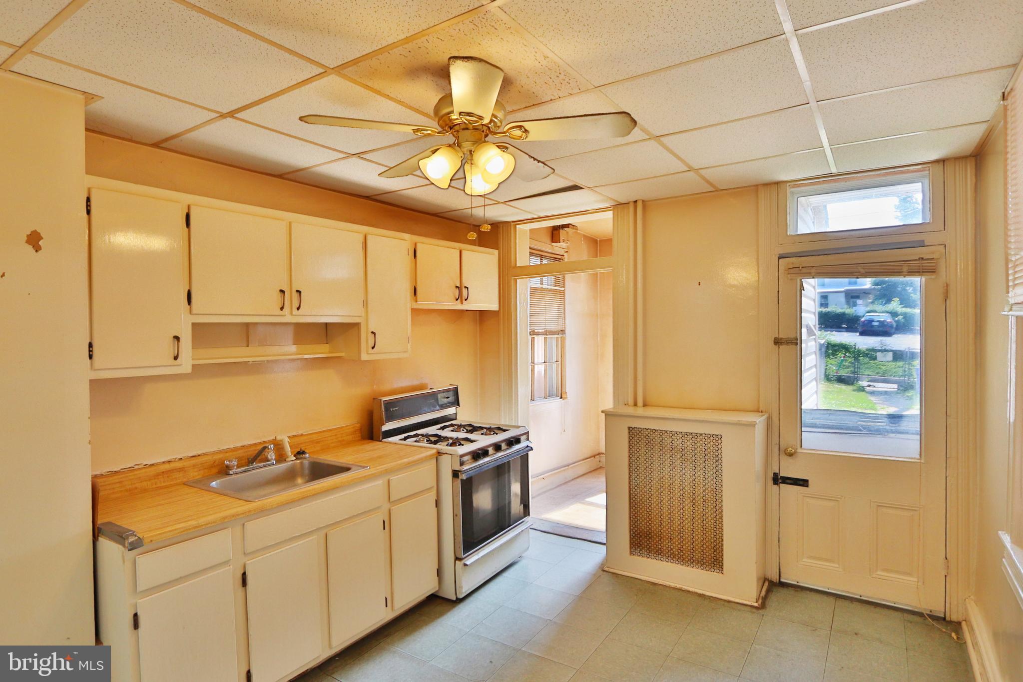 3529 Roland Avenue Baltimore, MD 21211 - Photo 6 of 16 Kitchen with walk out to fenced-in backyard