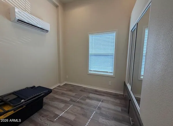 a room with a bed and a window