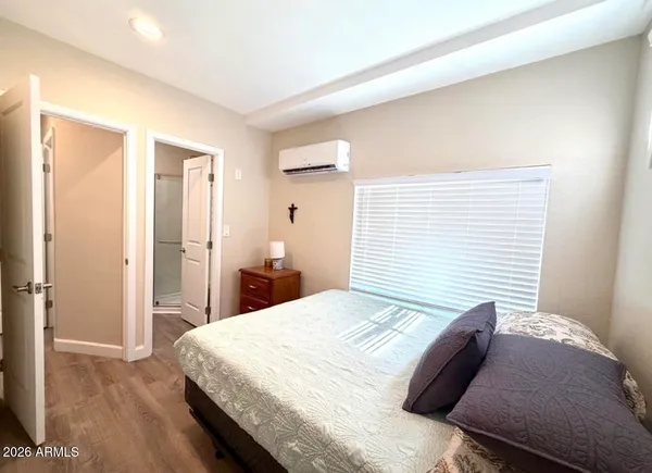 a bedroom with a bed and a dresser