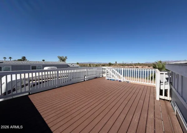 a view of balcony with wooden floor