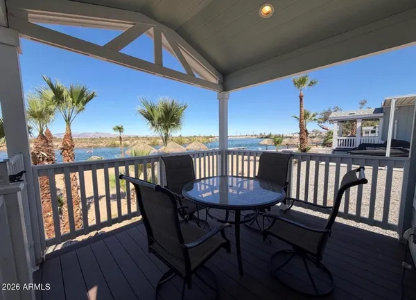a view of a house with outdoor seating space