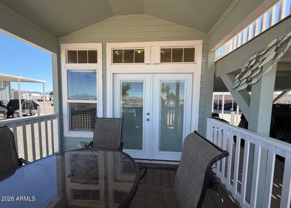 a view of balcony with wooden floor