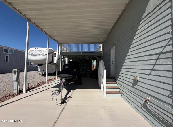 a view of swimming pool with outdoor seating and plants