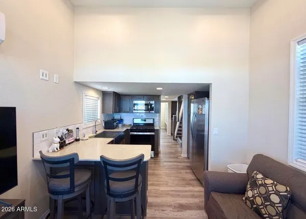 a large living room with furniture
