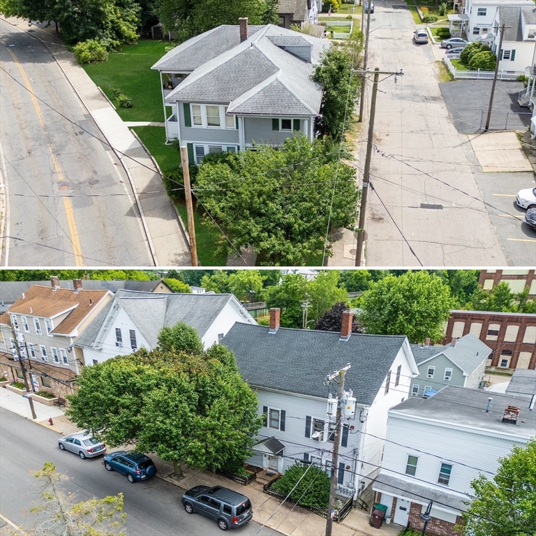 an aerial view of a house with garden space and street view