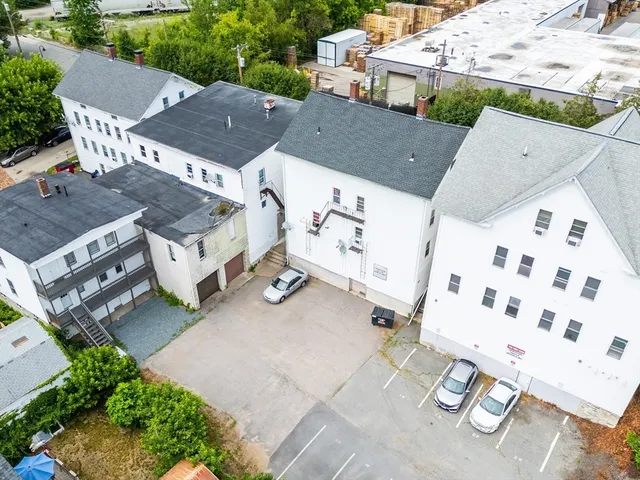 an aerial view of a house with outdoor space