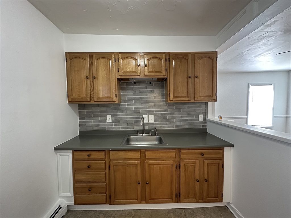 0 River & Transit Street Woonsocket, RI 02895 - Photo 19 of 33 a kitchen with stainless steel appliances granite countertop a sink and cabinets