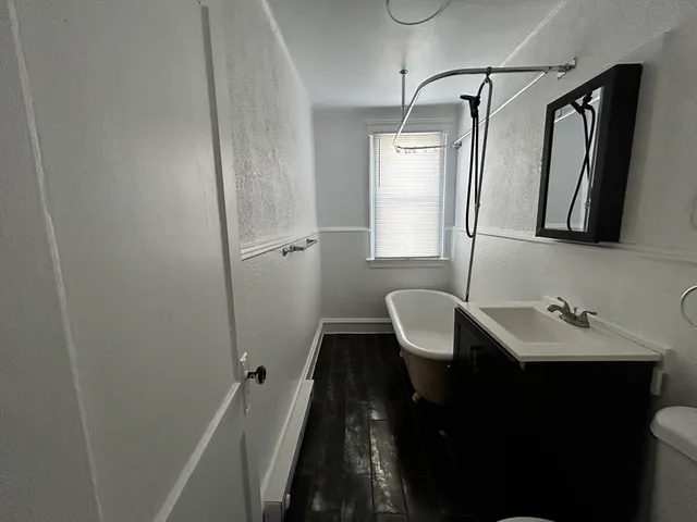 a bathroom with a sink toilet and tub