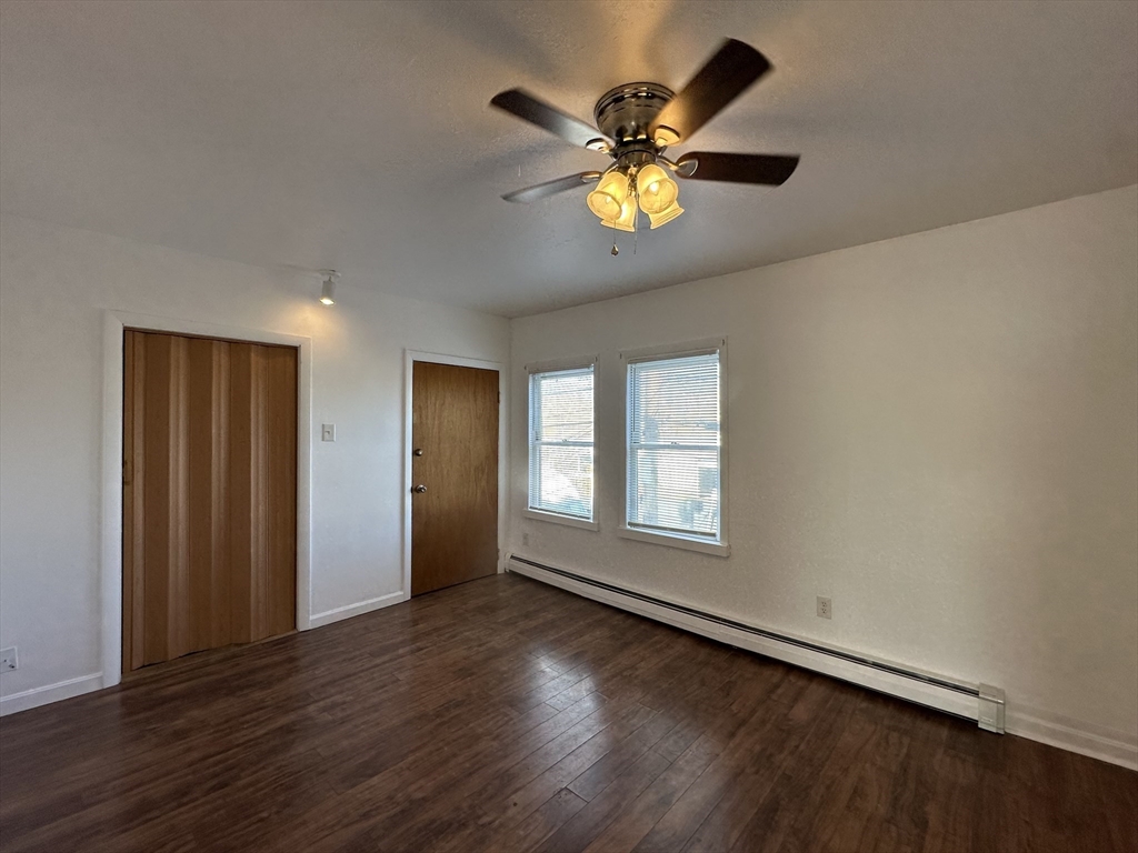 0 River & Transit Street Woonsocket, RI 02895 - Photo 30 of 33 a view of an empty room with a window and wooden floor
