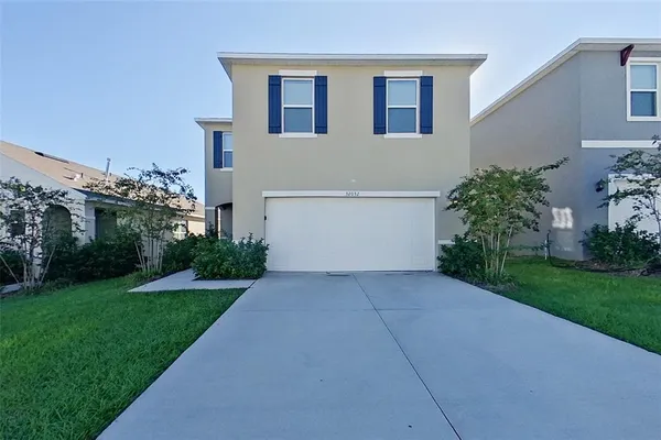a house with garden in front of it
