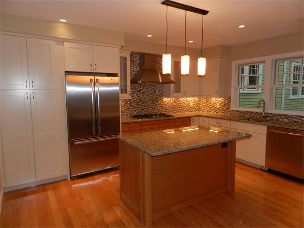 21 Glenland Road, Unit 2 Chestnut Hill, MA 02467 - Photo 2 of 30 a kitchen with stainless steel appliances granite countertop a sink and a refrigerator