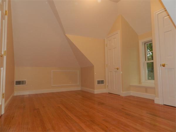 21 Glenland Road, Unit 2 Chestnut Hill, MA 02467 - Photo 25 of 30 a view of an empty room with wooden floor