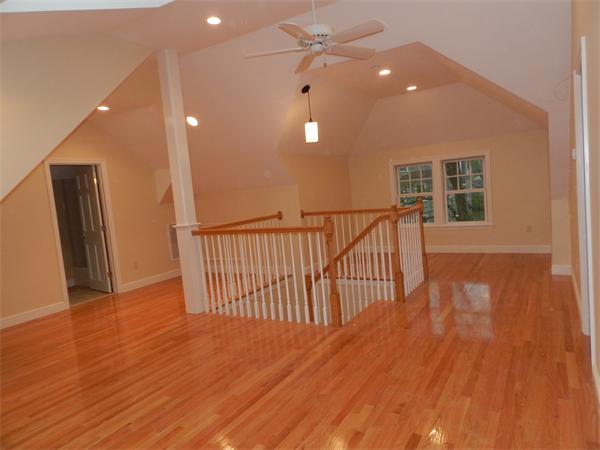 21 Glenland Road, Unit 2 Chestnut Hill, MA 02467 - Photo 28 of 30 a view of a hallway with wooden floor