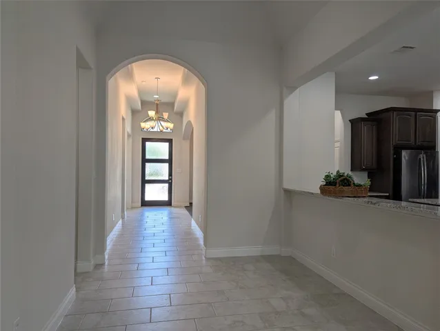 a spacious bathroom with a tub sink shower and mirror