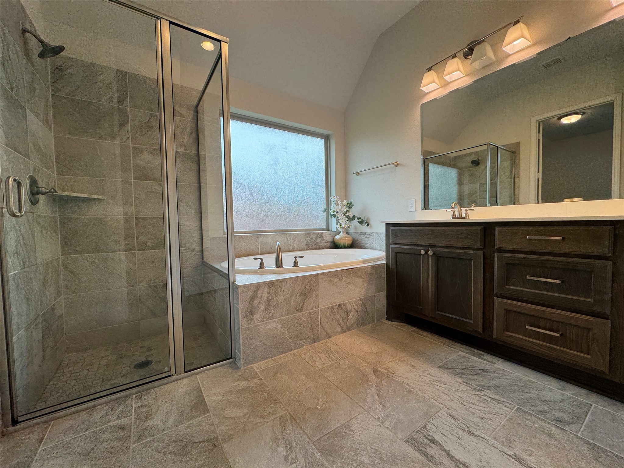 10323 Granite Court Rosharon, TX 77583 - Photo 15 of 44 a spacious bathroom with a tub sink shower and mirror