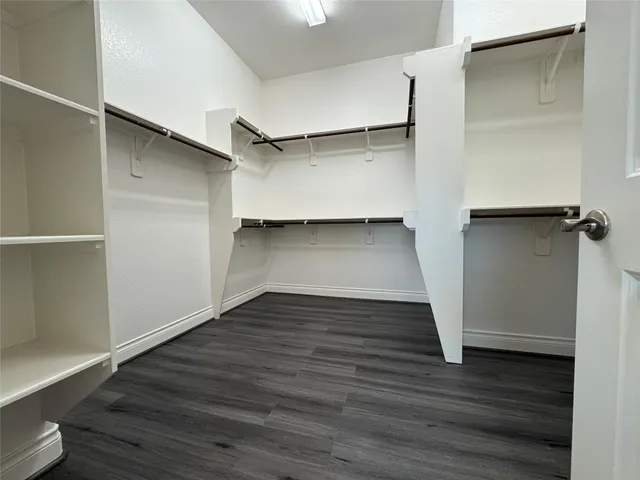 a kitchen with granite countertop kitchen island a sink appliances and a counter space