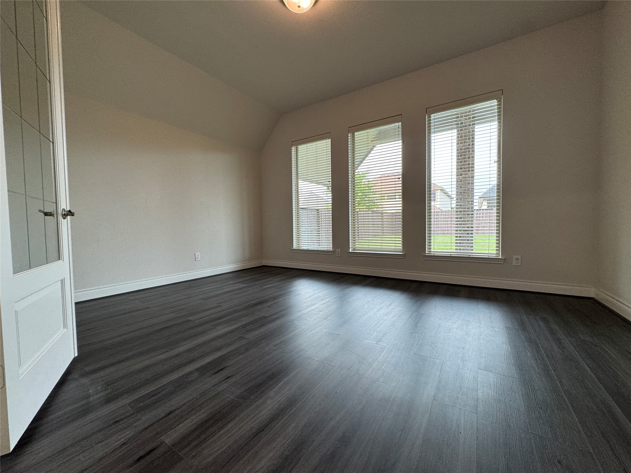 10323 Granite Court Rosharon, TX 77583 - Photo 20 of 44 wooden floor in an empty room with a window