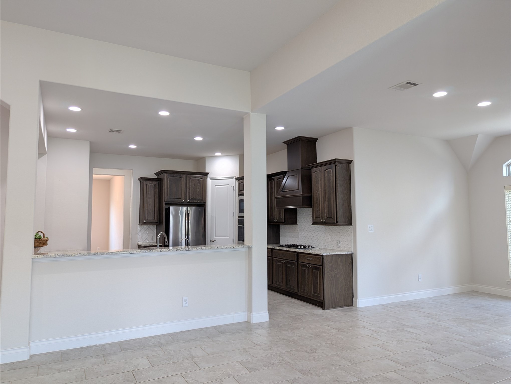 10323 Granite Court Rosharon, TX 77583 - Photo 22 of 44 a kitchen with stainless steel appliances a refrigerator and a sink