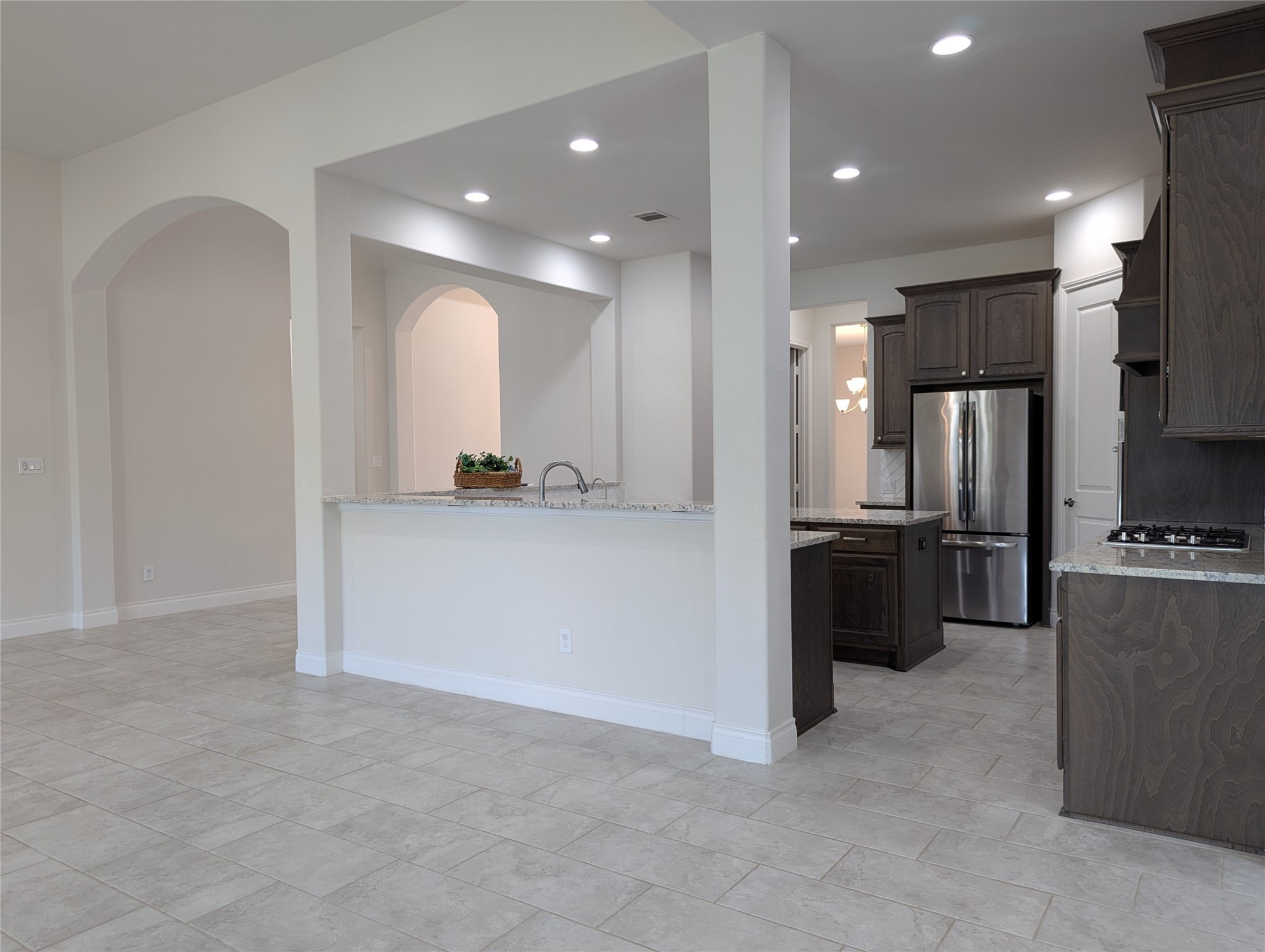 10323 Granite Court Rosharon, TX 77583 - Photo 23 of 44 a view of a kitchen with a refrigerator and a sink