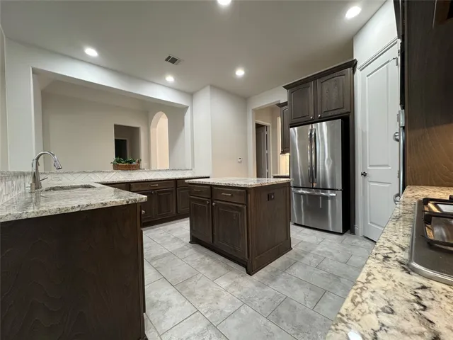 a view of a house with a backyard and porch