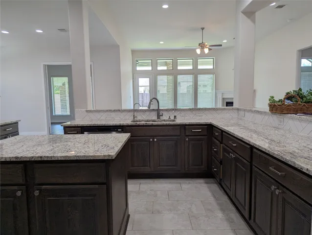 a view of a house with a big yard plants and large trees